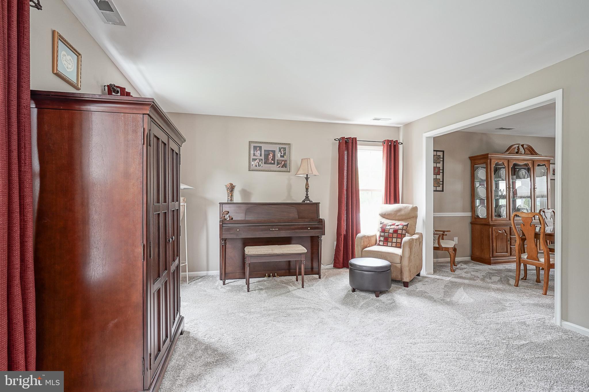 14 Filly Way Sewell, NJ 08080 - Photo 5 of 44 a living room with furniture cabinets and a window