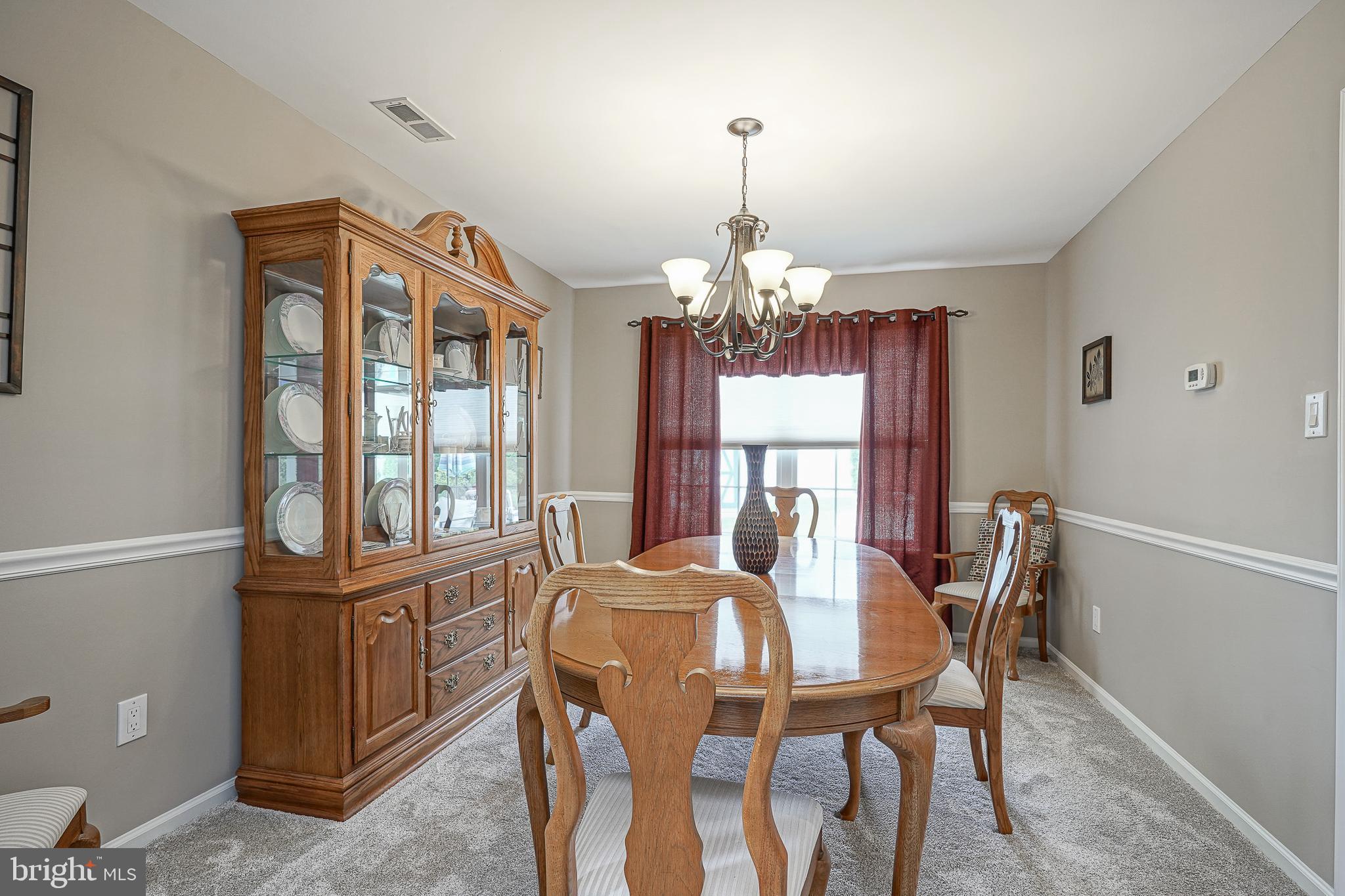 14 Filly Way Sewell, NJ 08080 - Photo 8 of 44 a view of a dining room with furniture a chandelier and wooden floor