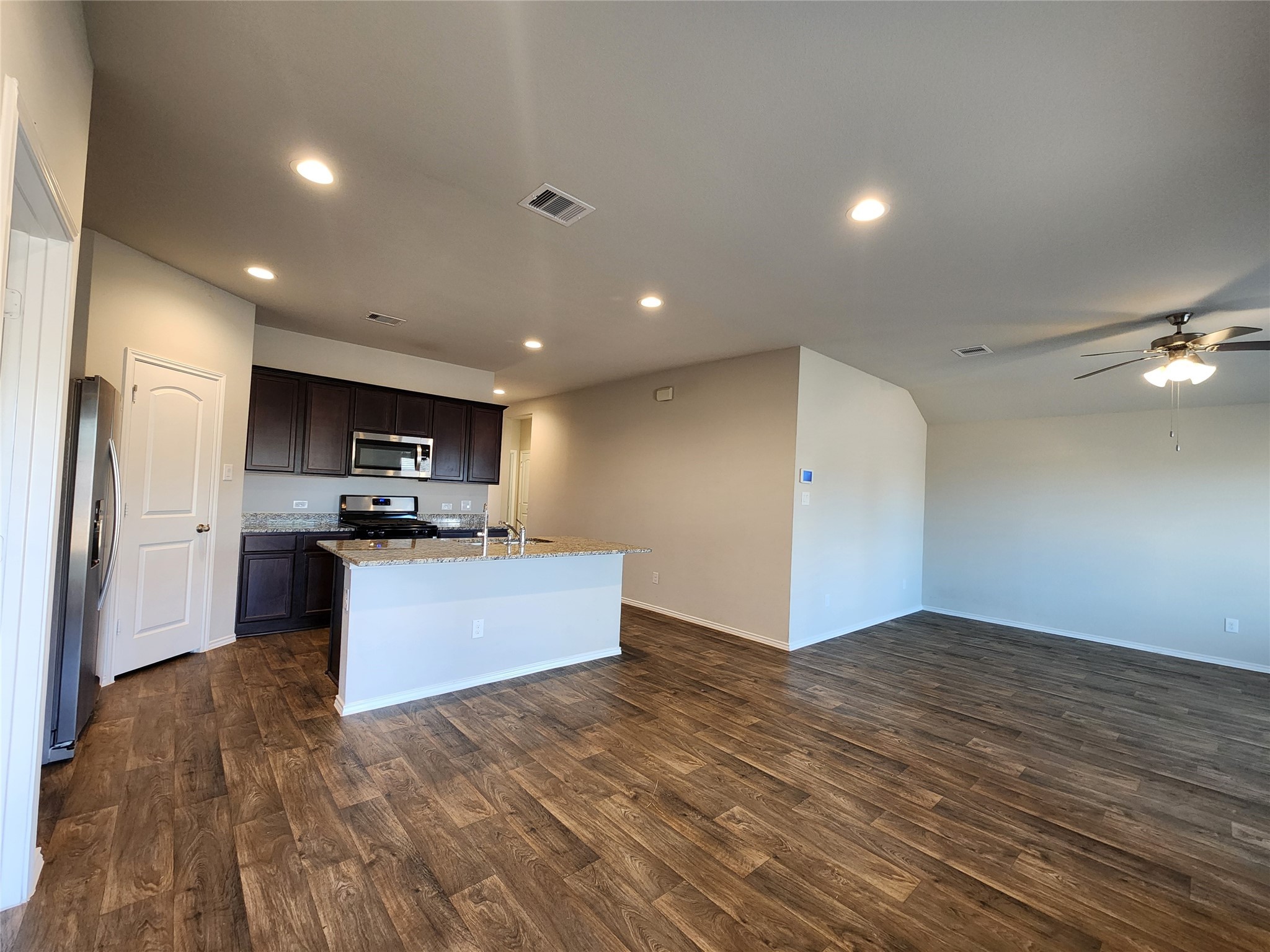 18277 Eaton Mill Drive New Caney, TX 77357 - Photo 8 of 28 a view of kitchen with refrigerator and stove