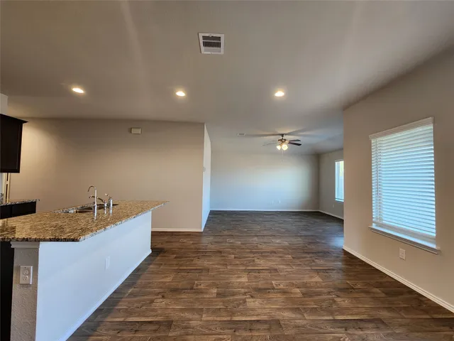a view of a big room with kitchen