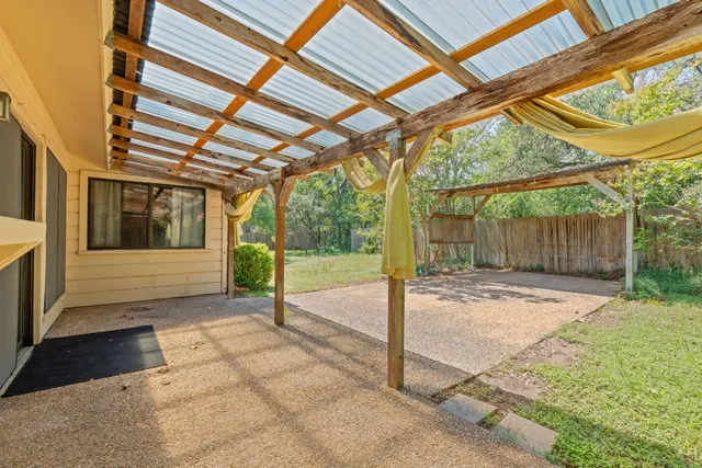 a house view with a backyard space