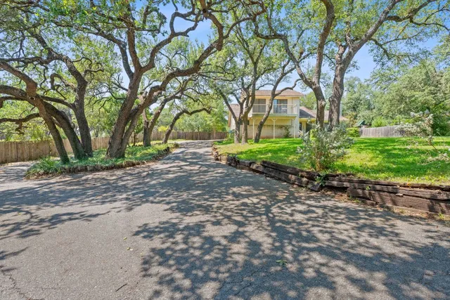 a view of a tree in front of a house