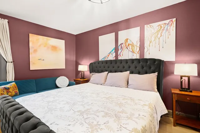 a bedroom with a bed and window