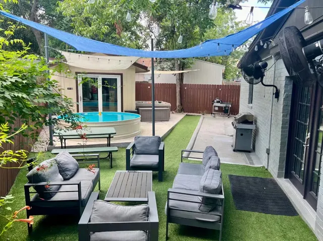 a backyard of a house with seating space