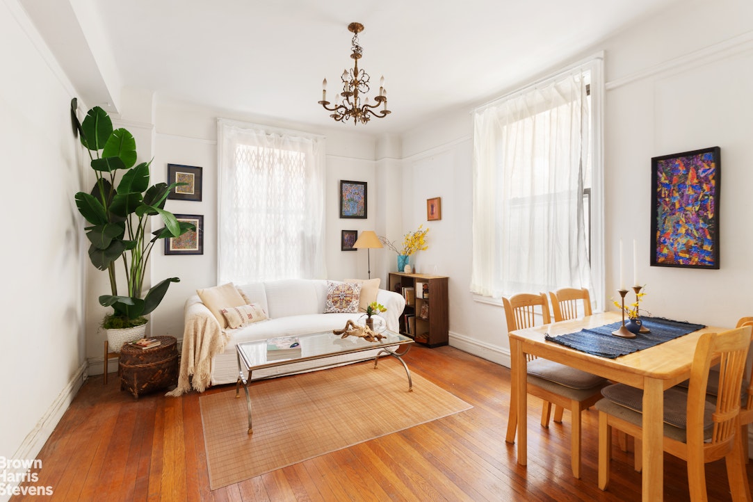 a bedroom with furniture and a chandelier