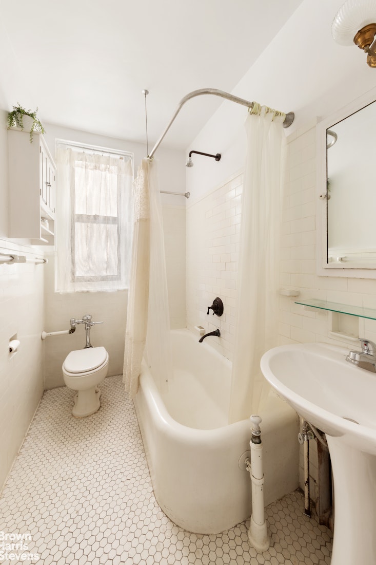 395 Riverside Drive, Unit 1D Manhattan, NY 10025 - Photo 6 of 9 a bathroom with a sink toilet bathtub and shower