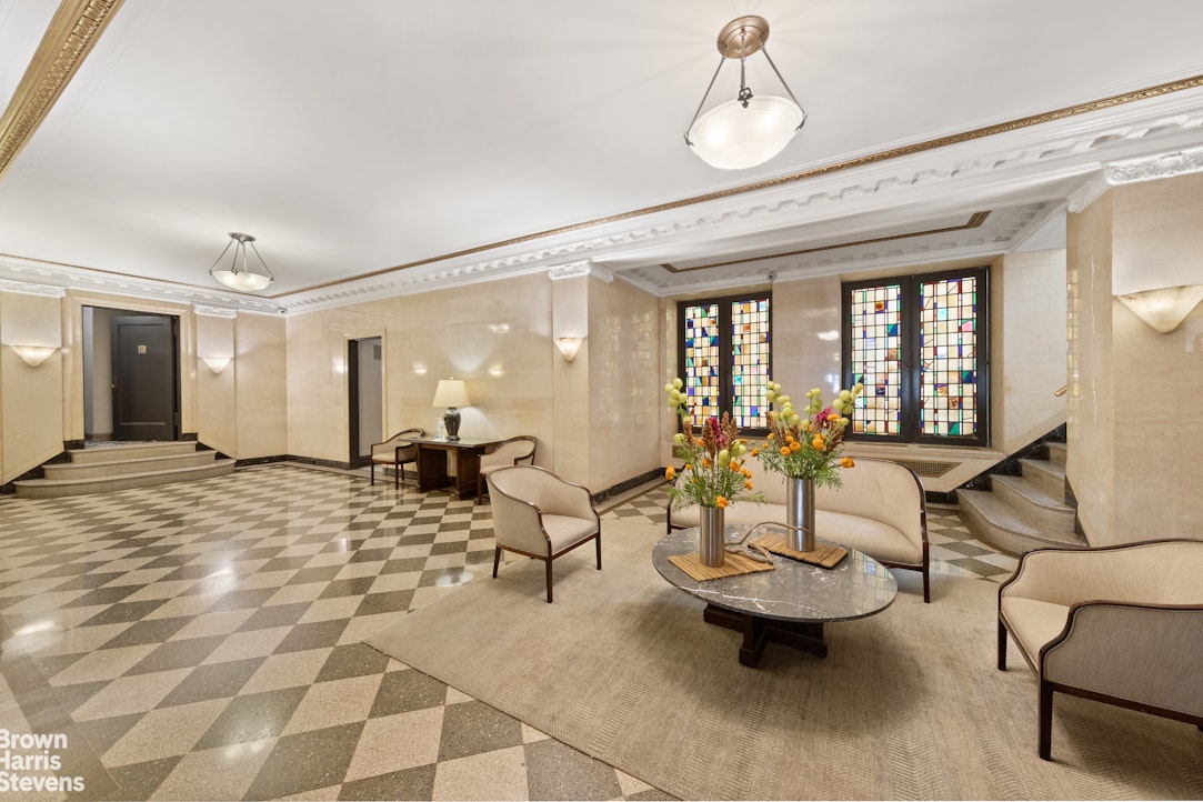 395 Riverside Drive, Unit 1D Manhattan, NY 10025 - Photo 8 of 9 a living room with furniture and chandelier