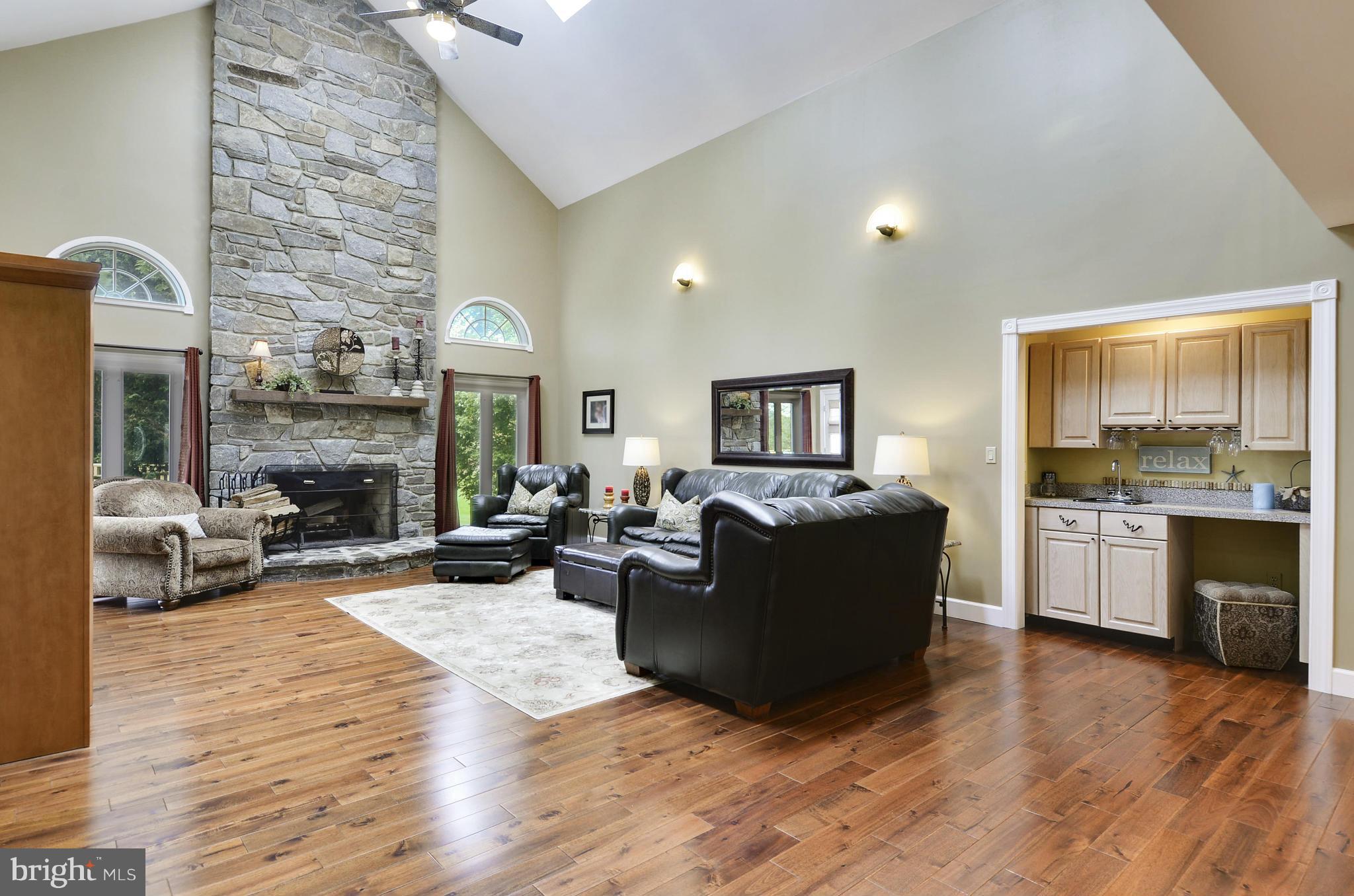 5006 South Renn Court Frederick, MD 21703 - Photo 4 of 30 a living room with furniture and a fireplace