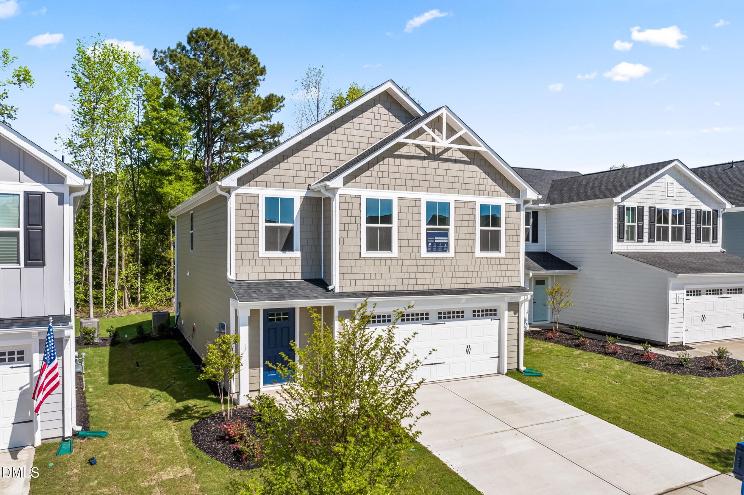 129 Cavalier Rider Run Wendell, NC 27591 - Photo 1 of 38 a front view of a house with a yard
