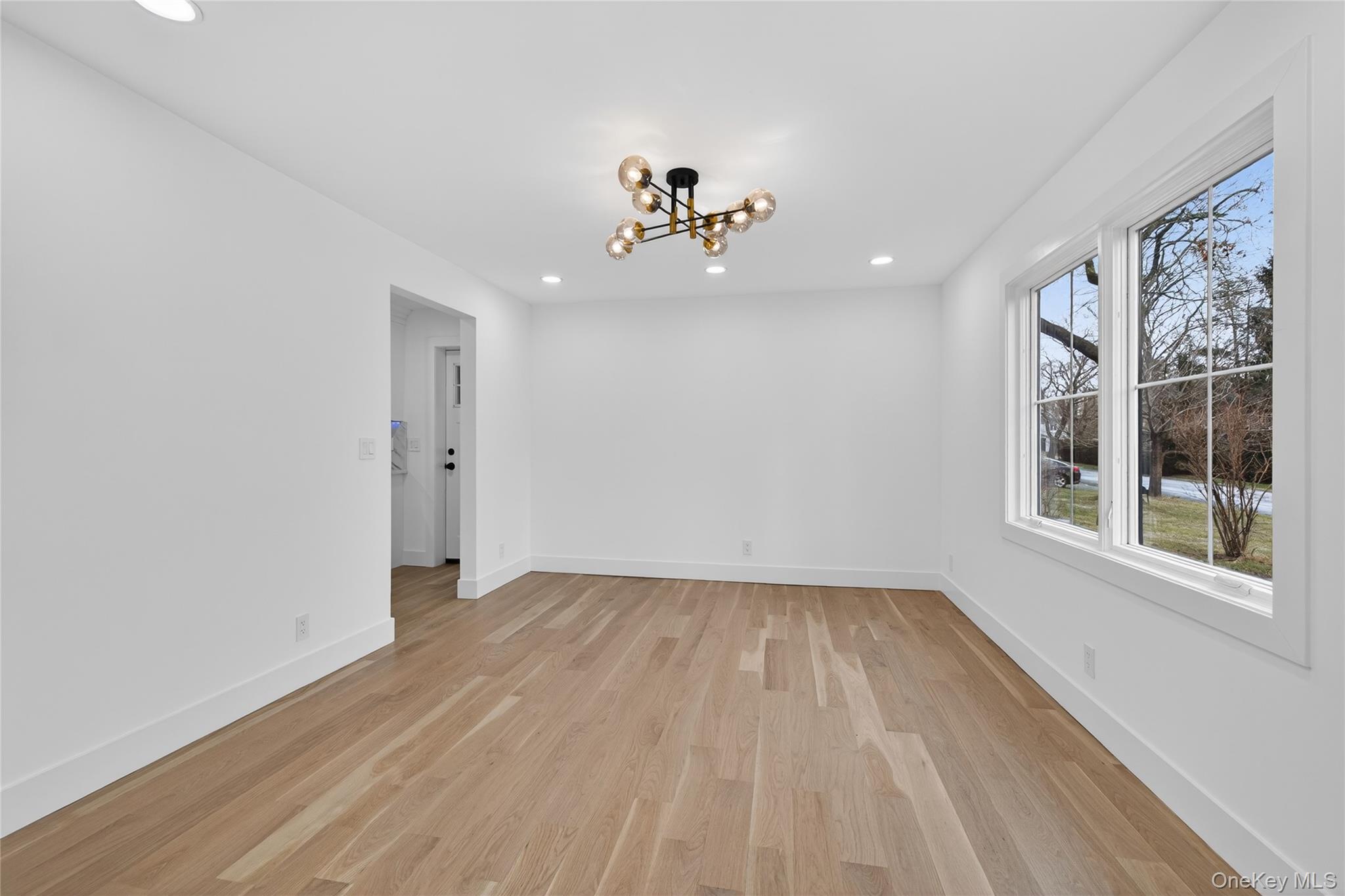 199 Salem Road East Hills, NY 11577 - Photo 14 of 40 Unfurnished dining area featuring a chandelier, recessed lighting, and light wood finished floors