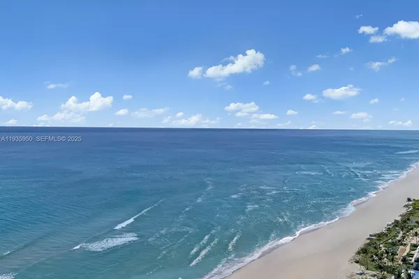 a view of a balcony with an ocean view