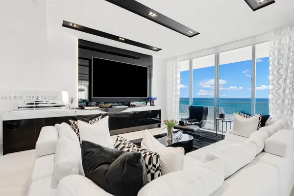 a living room with furniture and a flat screen tv