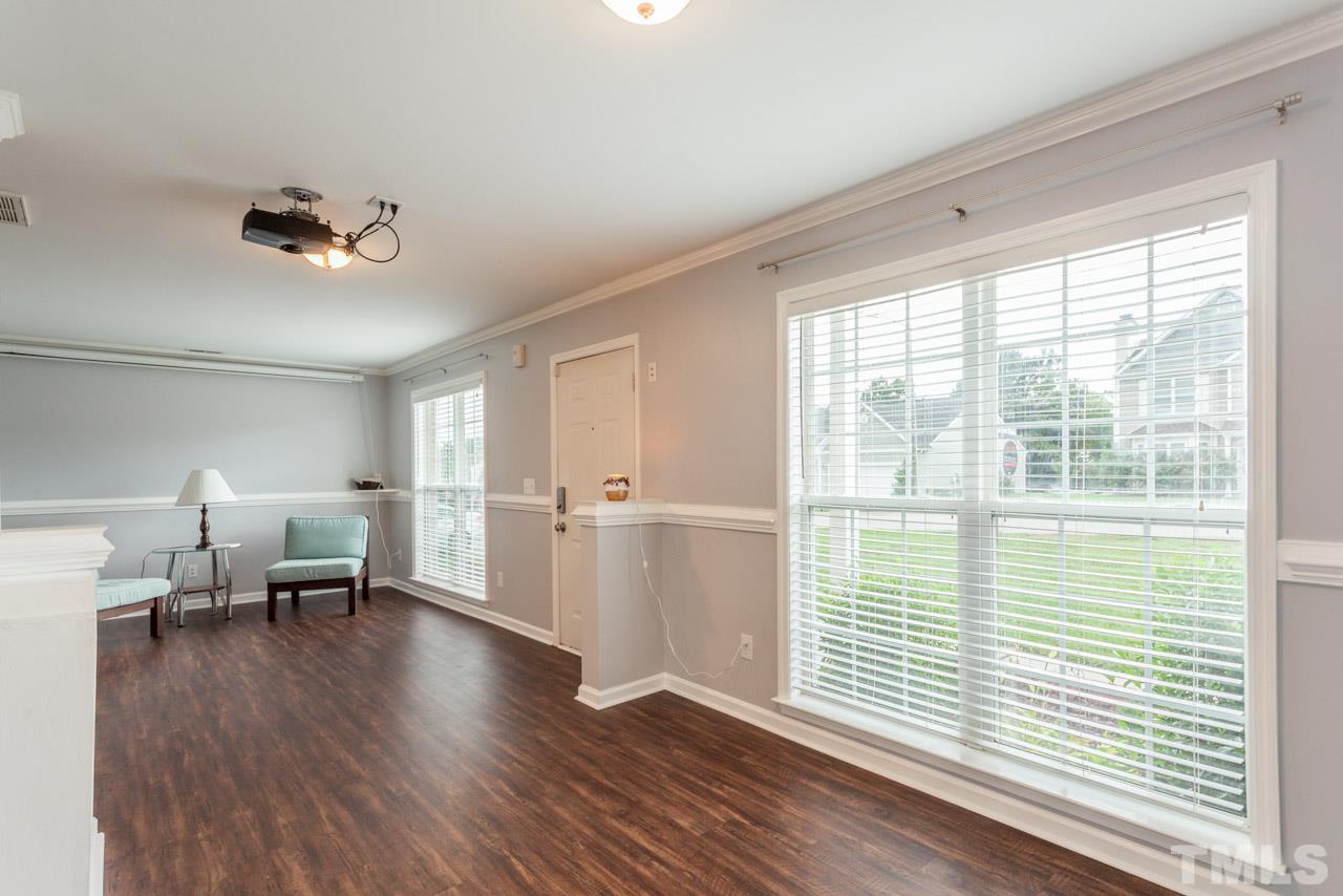 5216 Cardinal Grove Boulevard Raleigh, NC 27616 - Photo 3 of 25 a living room with furniture and a window