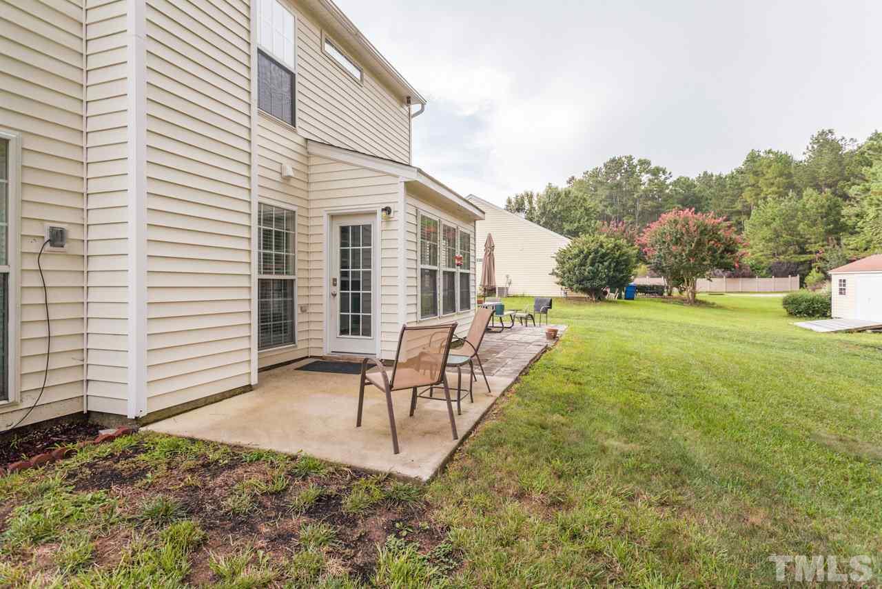 5216 Cardinal Grove Boulevard Raleigh, NC 27616 - Photo 24 of 25 a view of a house with backyard and a garden