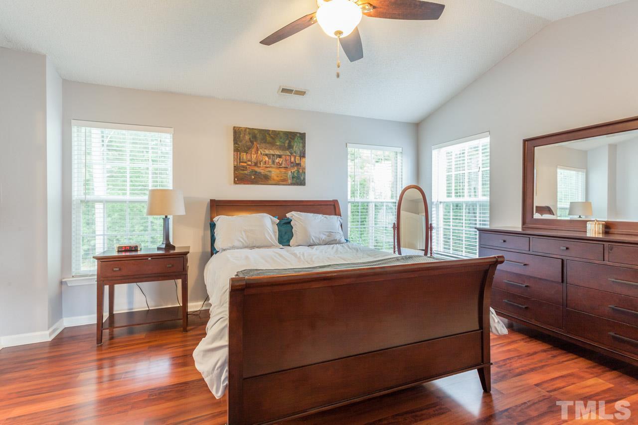 5216 Cardinal Grove Boulevard Raleigh, NC 27616 - Photo 25 of 25 a bed room with a bed and a couch