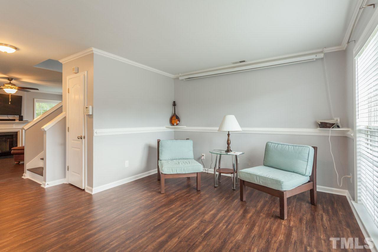 5216 Cardinal Grove Boulevard Raleigh, NC 27616 - Photo 5 of 25 a living room with furniture and a wooden floor