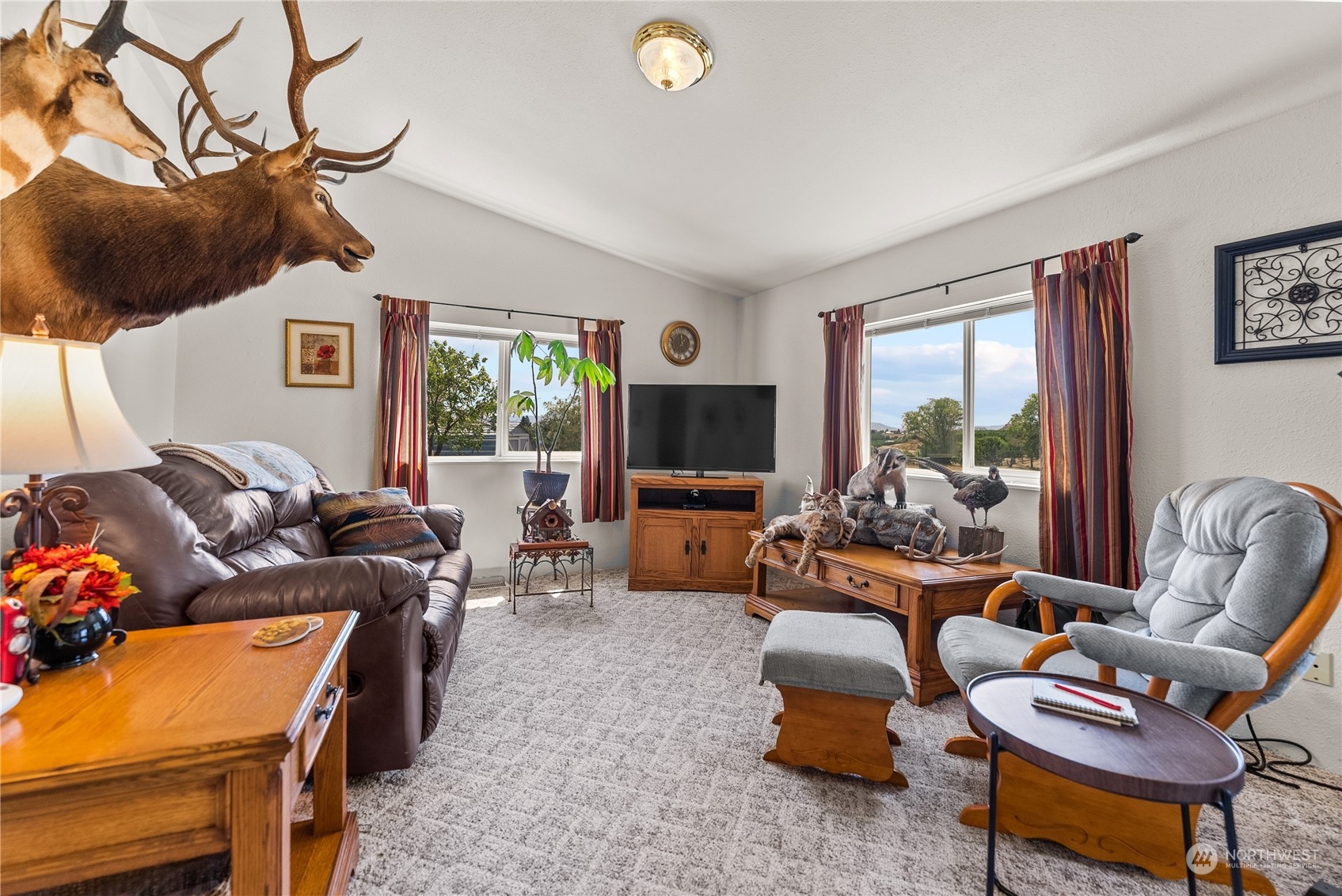50 Soren Peterson Road Riverside, WA 98849 - Photo 27 of 37 a living room with furniture and a flat screen tv