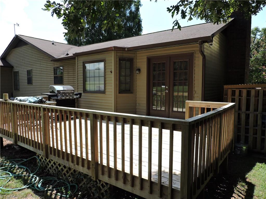 7116 North River Road Oak Ridge, NC 27310 - Photo 17 of 22 Great deck for relaxing and entertaining.