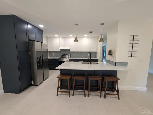 an empty room with a ceiling fan and window
