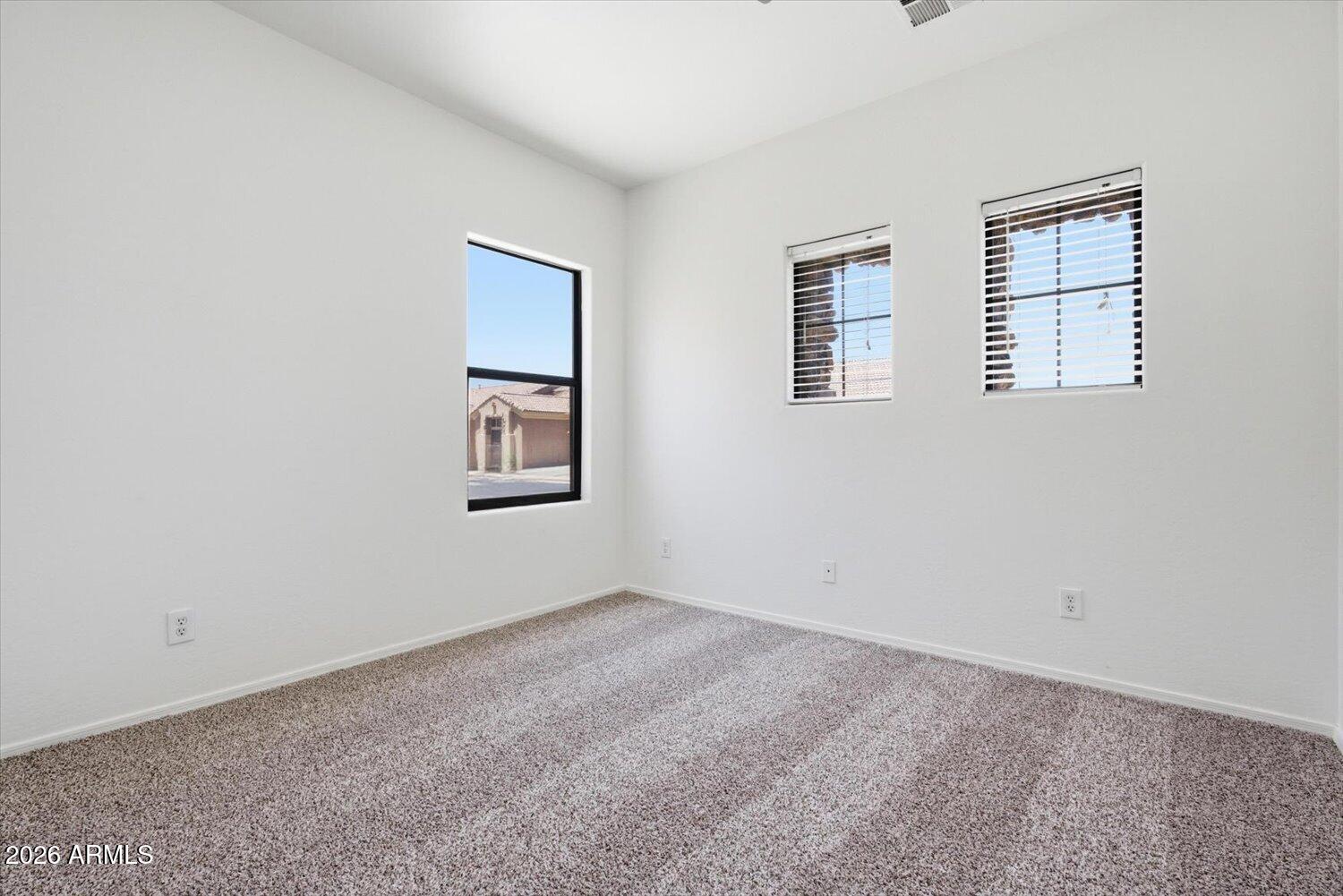 2565 South Signal Butte Road, Unit 23 Mesa, AZ 85209 - Photo 19 of 29 a view of an empty room with a window