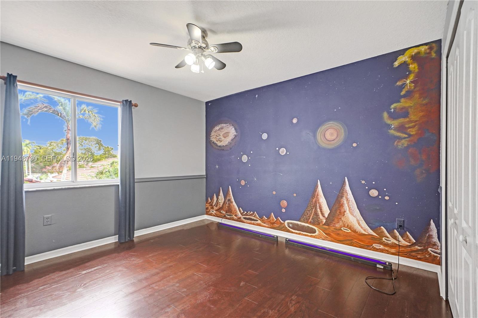 5502 Southwest 162nd Place Miami, FL 33185 - Photo 41 of 72 a view of a livingroom with a ceiling fan and window