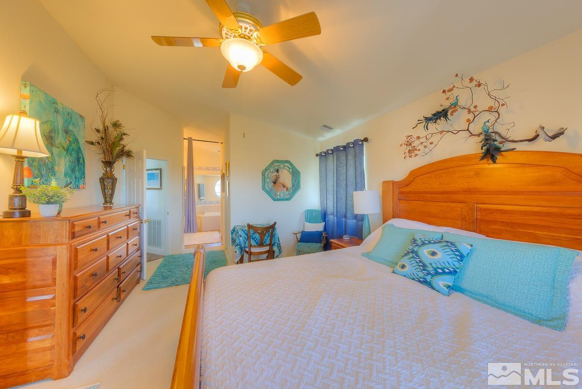 642 Talus Way Reno, NV 89503 - Photo 16 of 40 a bedroom with a bed mirror and window