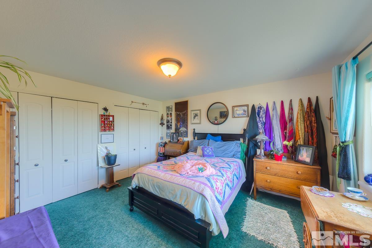 642 Talus Way Reno, NV 89503 - Photo 23 of 40 a bedroom with a bed and a window
