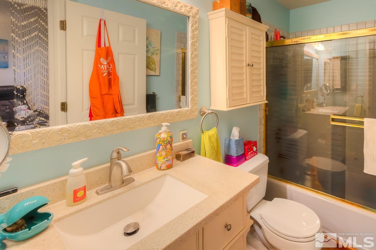 642 Talus Way Reno, NV 89503 - Photo 26 of 40 a bathroom with a sink vanity mirror and toilet