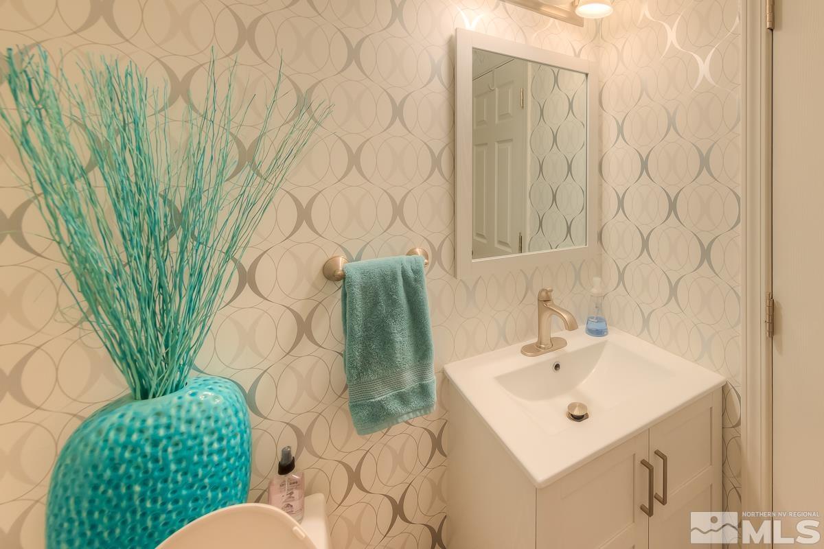 642 Talus Way Reno, NV 89503 - Photo 27 of 40 a bathroom with a sink and mirror