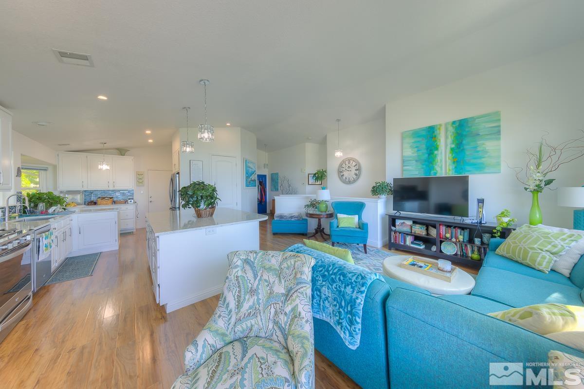 642 Talus Way Reno, NV 89503 - Photo 6 of 40 a living room with furniture and a flat screen tv
