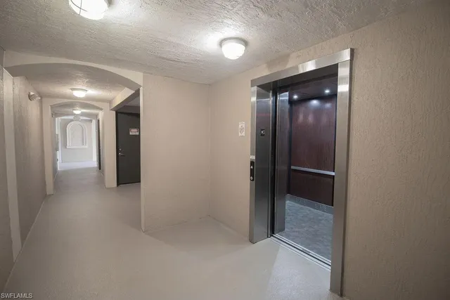 wooden floor in a hall with a bathroom