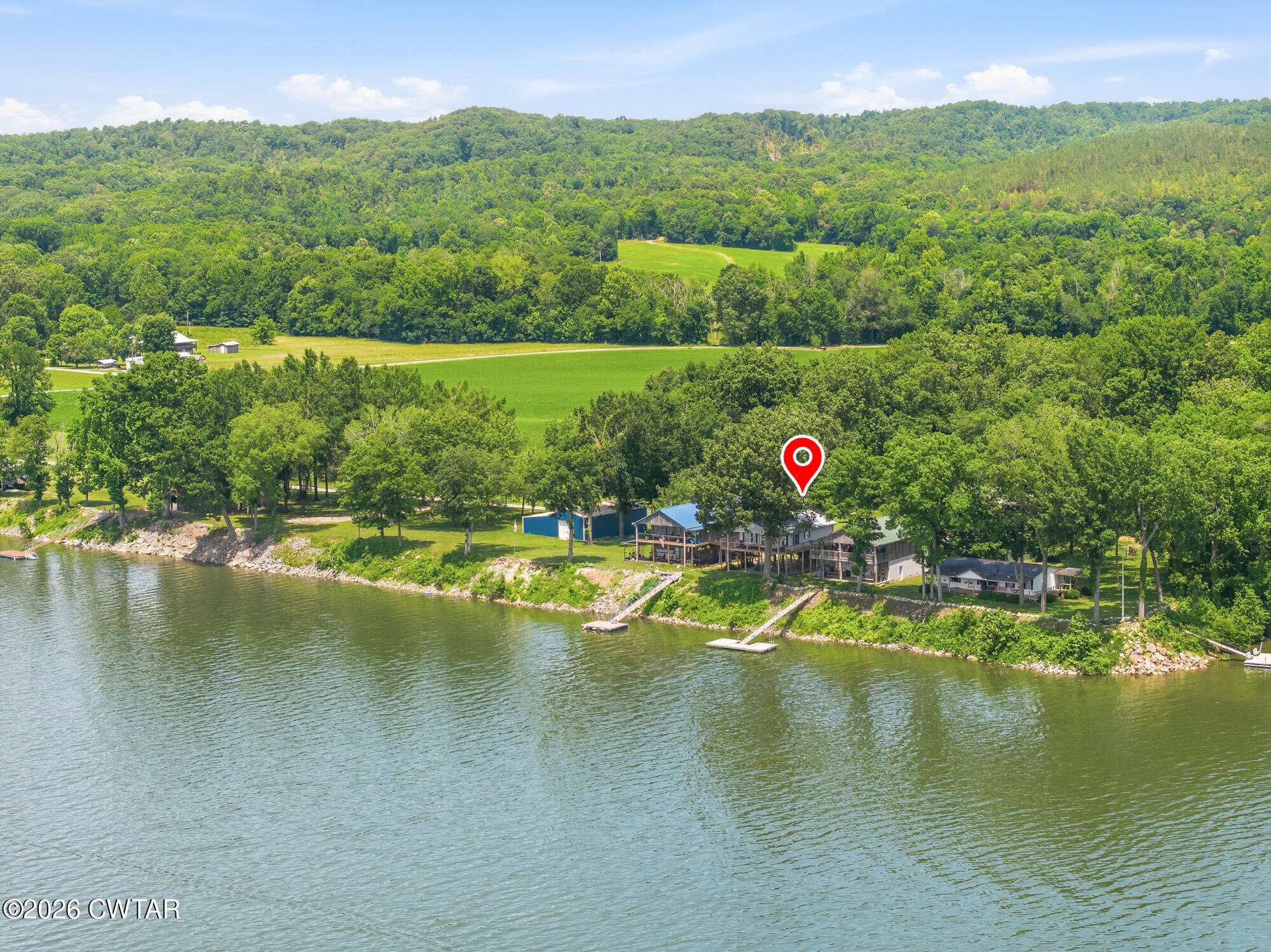 1728 Yarbro Landing Lane Decaturville, TN 38329 - Photo 39 of 44 a view of a lake with a mountain in the background