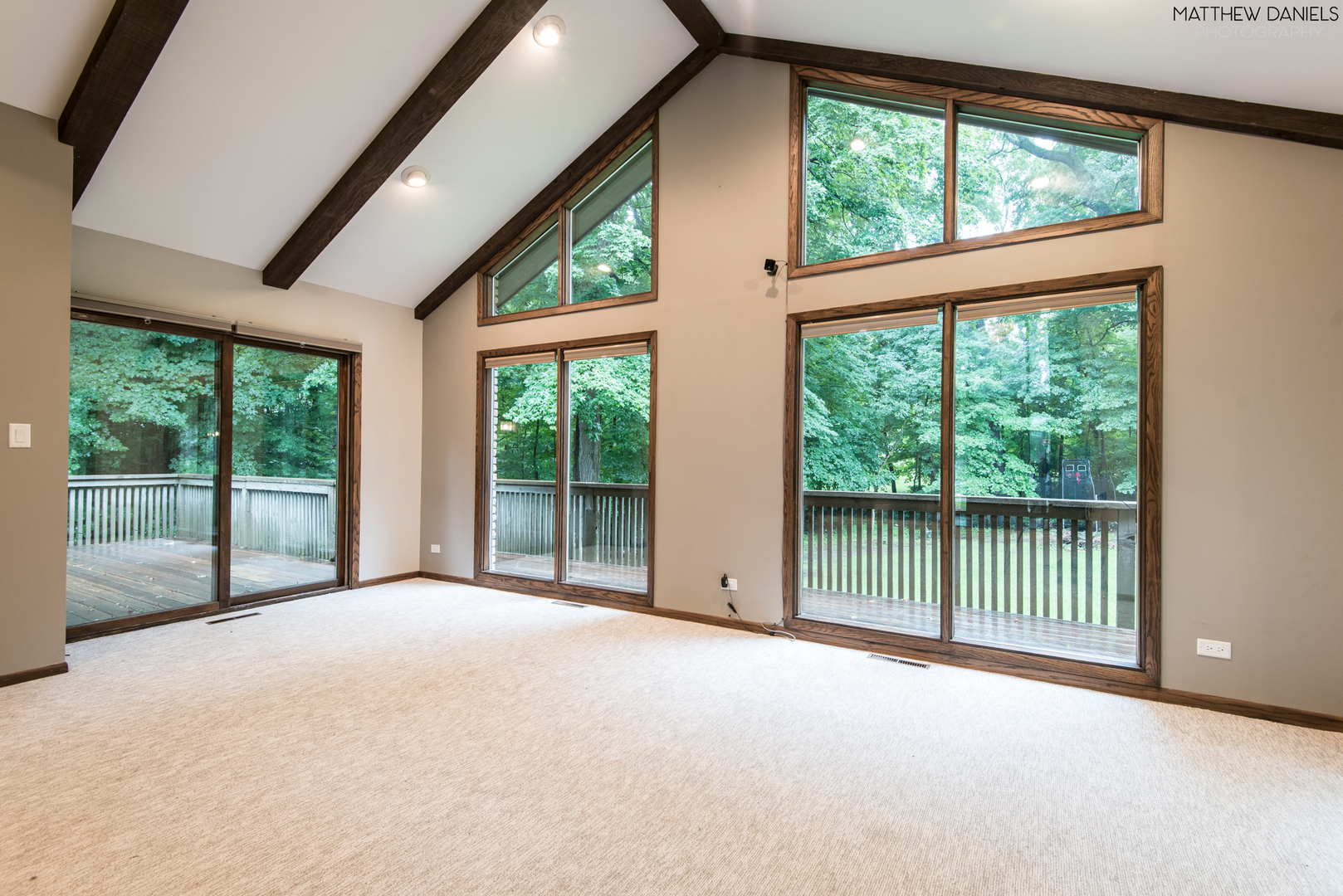 584 Aberdeen Road Frankfort, IL 60423 - Photo 14 of 60 a view of an empty room with wooden floor and a balcony