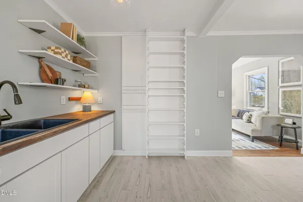 a kitchen with a sink dishwasher and cabinets