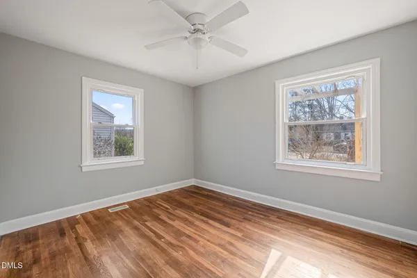 a view of an entryway with wooden floor