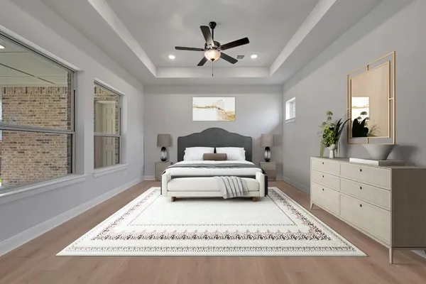 an empty room with wooden floor and ceiling fan