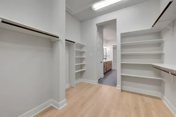 a view of an empty walk in closet