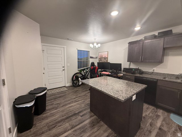 485 370 South Preston, ID 83263 - Photo 7 of 16 Kitchen featuring dark wood finish cabinets, a center island, hanging lights, dishwasher, and dark wood-type flooring