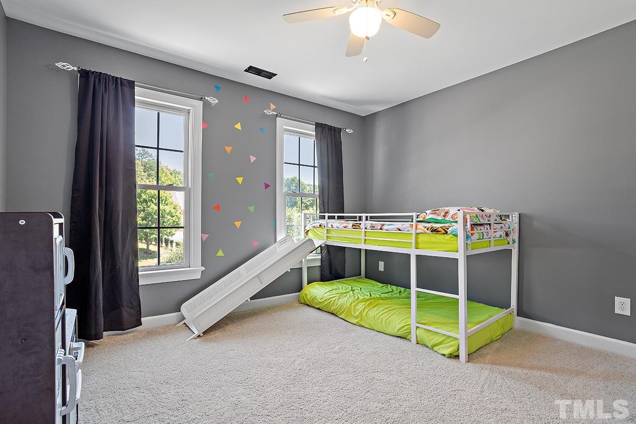709 Rushing Falls Place Fuquay-Varina, NC 27526 - Photo 18 of 28 a view of a bedroom with window