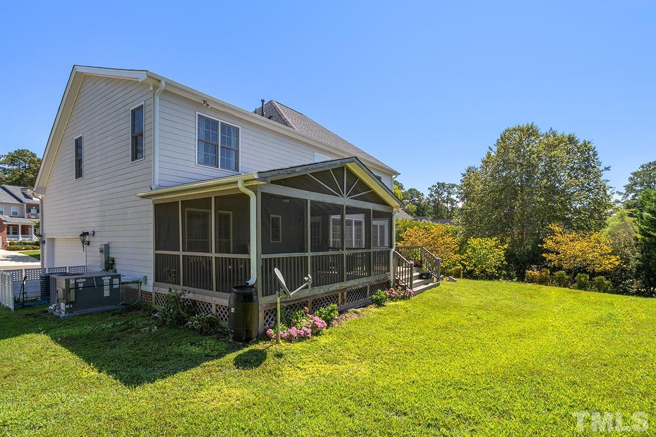 709 Rushing Falls Place Fuquay-Varina, NC 27526 - Photo 24 of 28 a view of house with backyard and garden