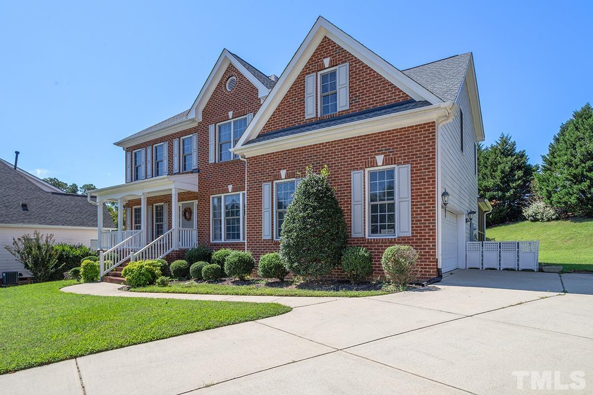 709 Rushing Falls Place Fuquay-Varina, NC 27526 - Photo 3 of 28 a front view of a house with garden