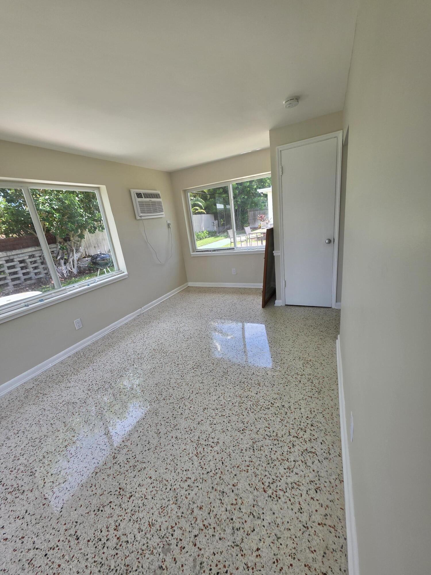 1216 Cabana Road, Unit 4 Singer Island, FL 33404 - Photo 8 of 10 an empty room with windows and closet