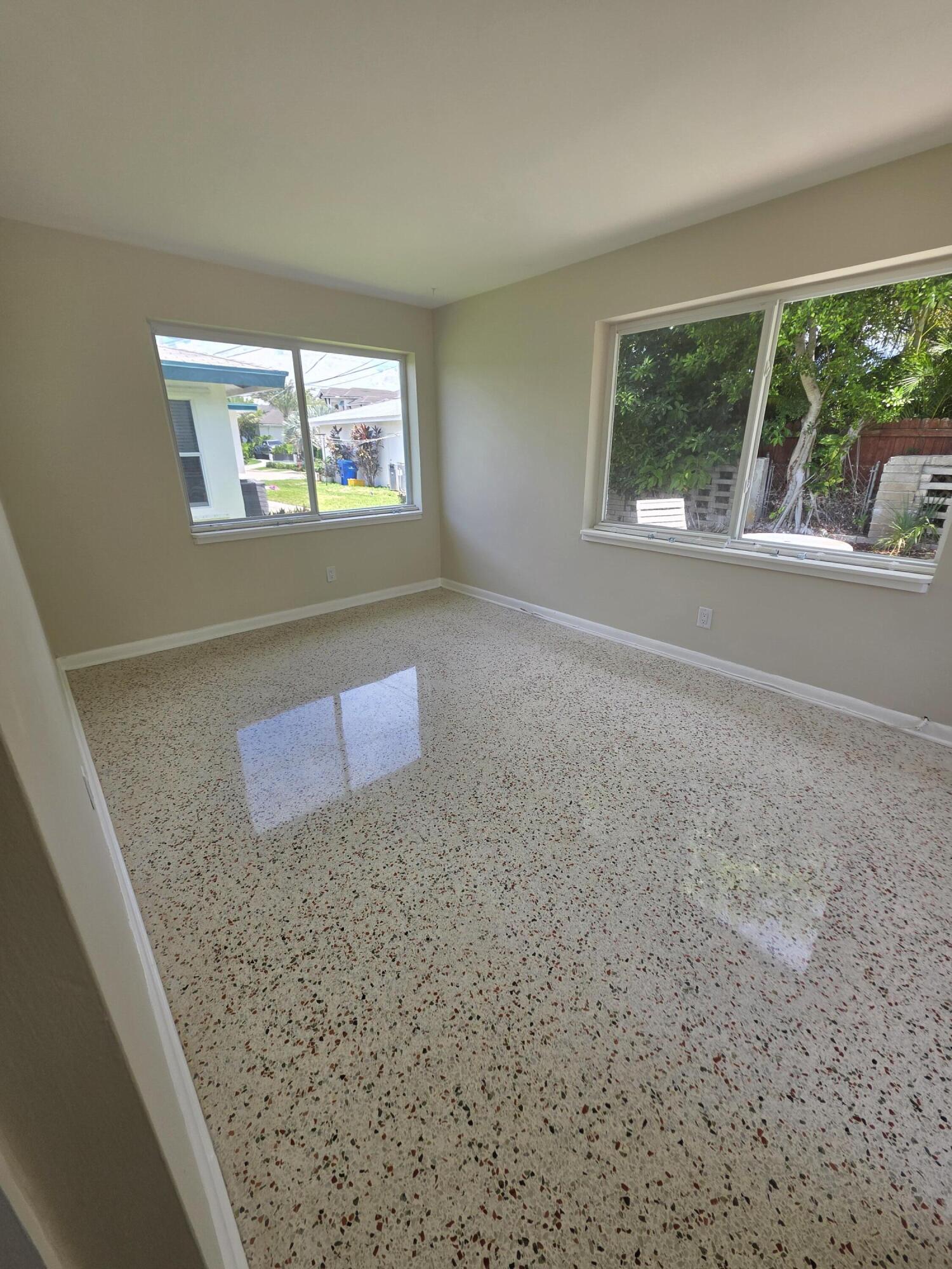 1216 Cabana Road, Unit 4 Singer Island, FL 33404 - Photo 9 of 10 a view of an empty room with a window