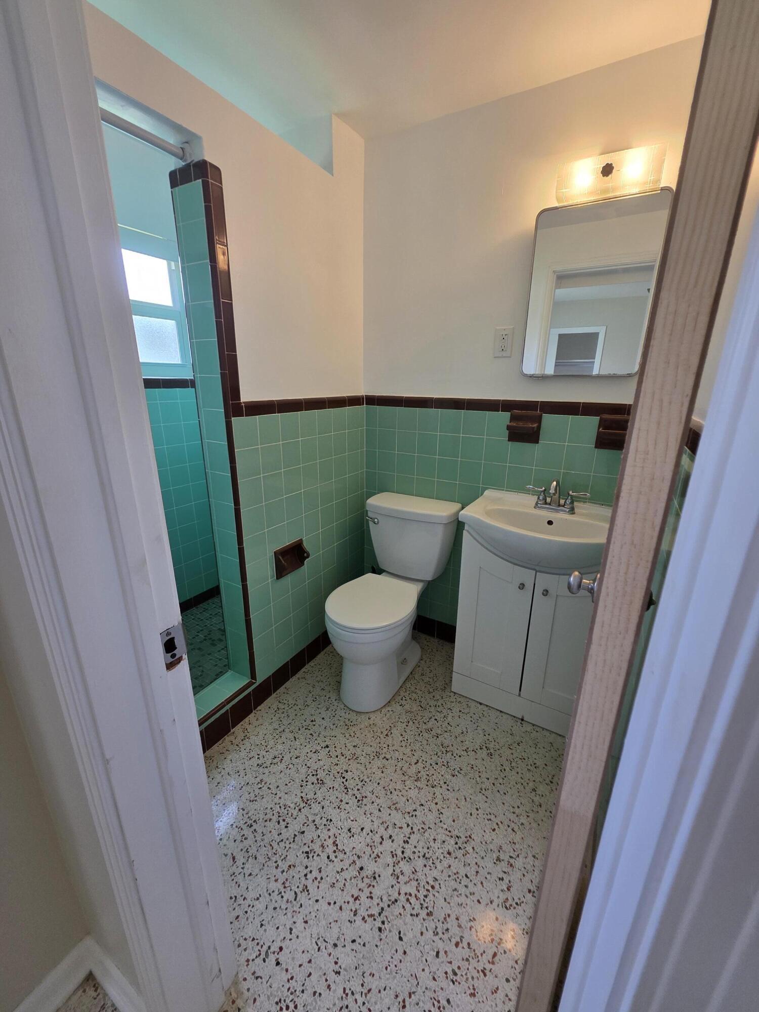1216 Cabana Road, Unit 4 Singer Island, FL 33404 - Photo 10 of 10 a bathroom with a sink and a toilet