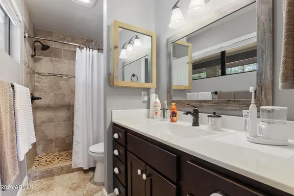 a bed room with a bed and a window