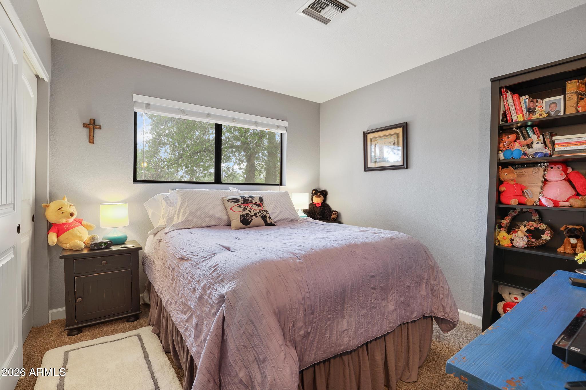 302 West Forest Drive Payson, AZ 85541 - Photo 13 of 39 a bed room with a bed and a window