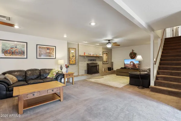 a room with furniture and pool table