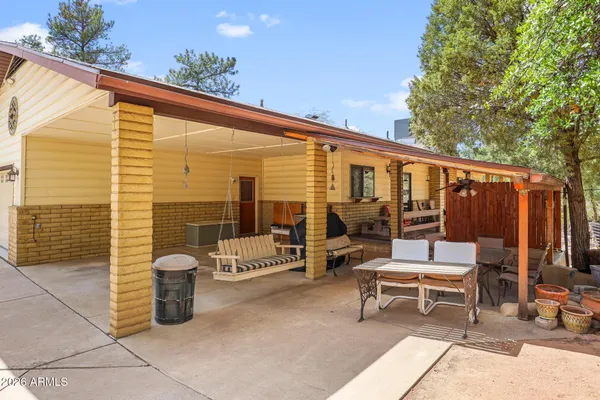 a balcony with wooden benches and wooden floor