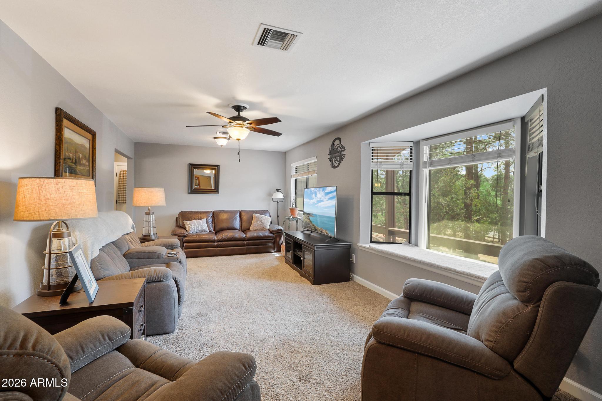302 West Forest Drive Payson, AZ 85541 - Photo 10 of 39 a living room with furniture and a large window