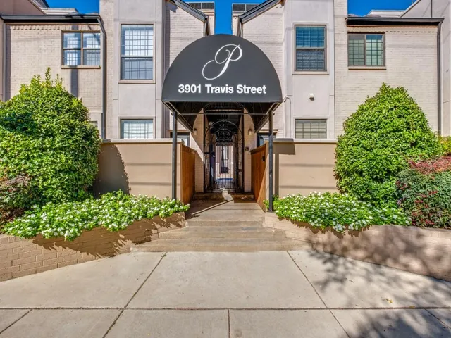 a front view of a building with an entrance gate